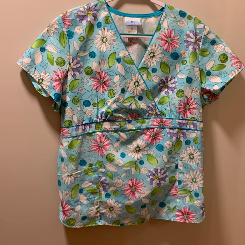 Turquoise and pink scrub top